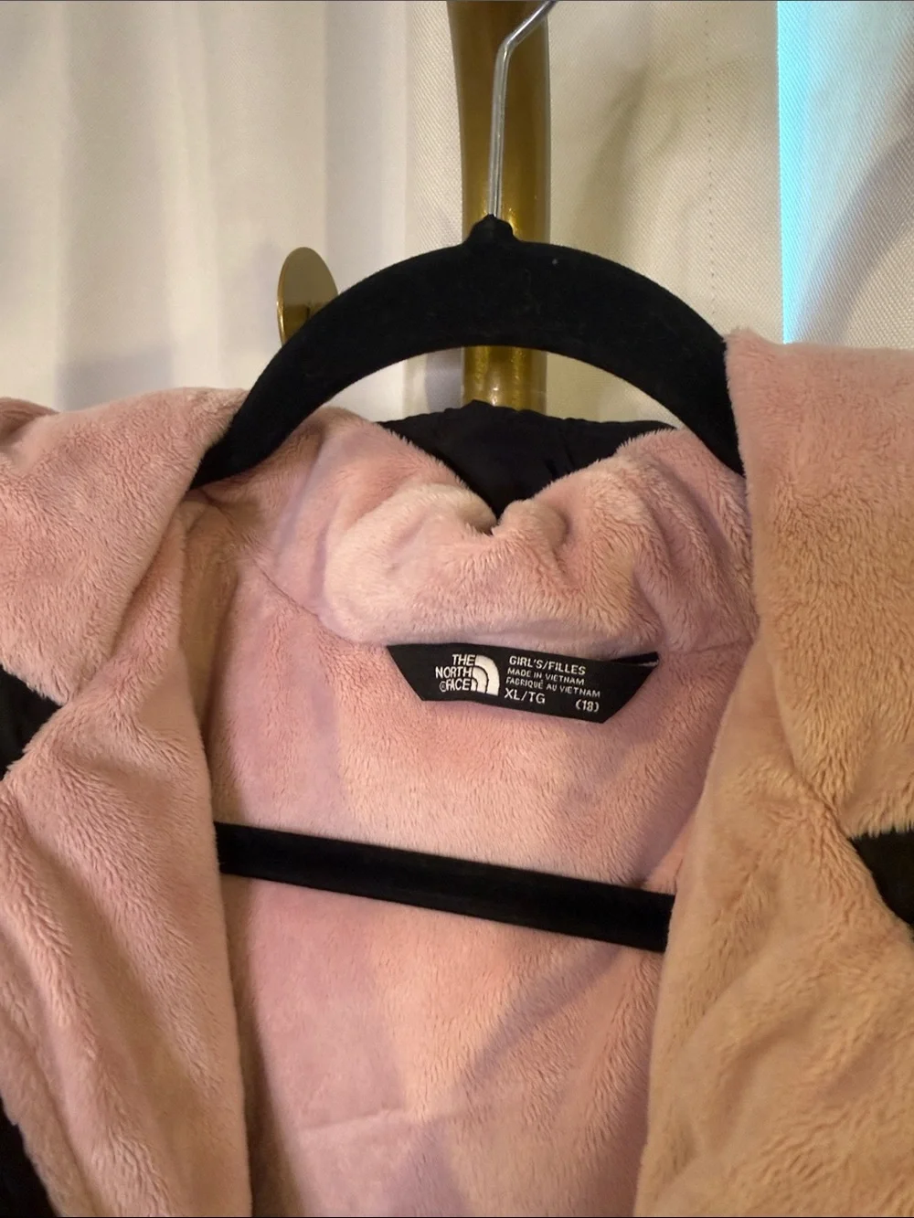 The North Face 550 Kids Black Puffer Jacket with Pink Lining Down Filled